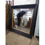 A Victorian ebonised and parcel gilt framed mirror