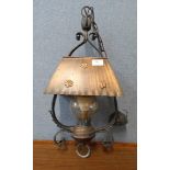 An Arts and Crafts wrought iron and copper hanging ceiling lantern