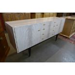 An Italian simulated marble sideboard