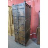 A large 19th Century style Indian hardwood and ironwork three door wedding cupboard