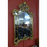 A Rococo style gilt framed mirror