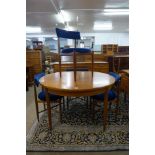 A G-Plan Fresco teak circular extending dining table and four chairs