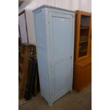 An early 20th Century painted pine and ply wood single door housekeeper's cupboard