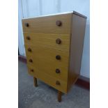 A teak chest of drawers