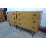 A pair of teak chests of drawers