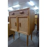 An Italian bamboo and rattan cabinet on stand