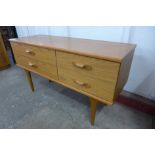 A small Austin Suite teak four drawer sideboard
