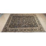 A large Persian blue ground Isfahan rug, 350 x 284cms