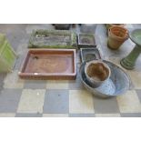 A Victorian saltglazed sink, a reconstituted stone sink, a pair of grates, a galvanised bucket and