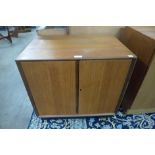 A teak two door record cabinet