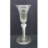 An 18th Century wine glass, circa 1750, having a bell bowl with solid base over a shoulder knop