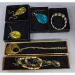 Seven pieces of abolone style jewellery, boxed