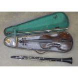 A cased violin and a Boosey and Hawkes clarinet