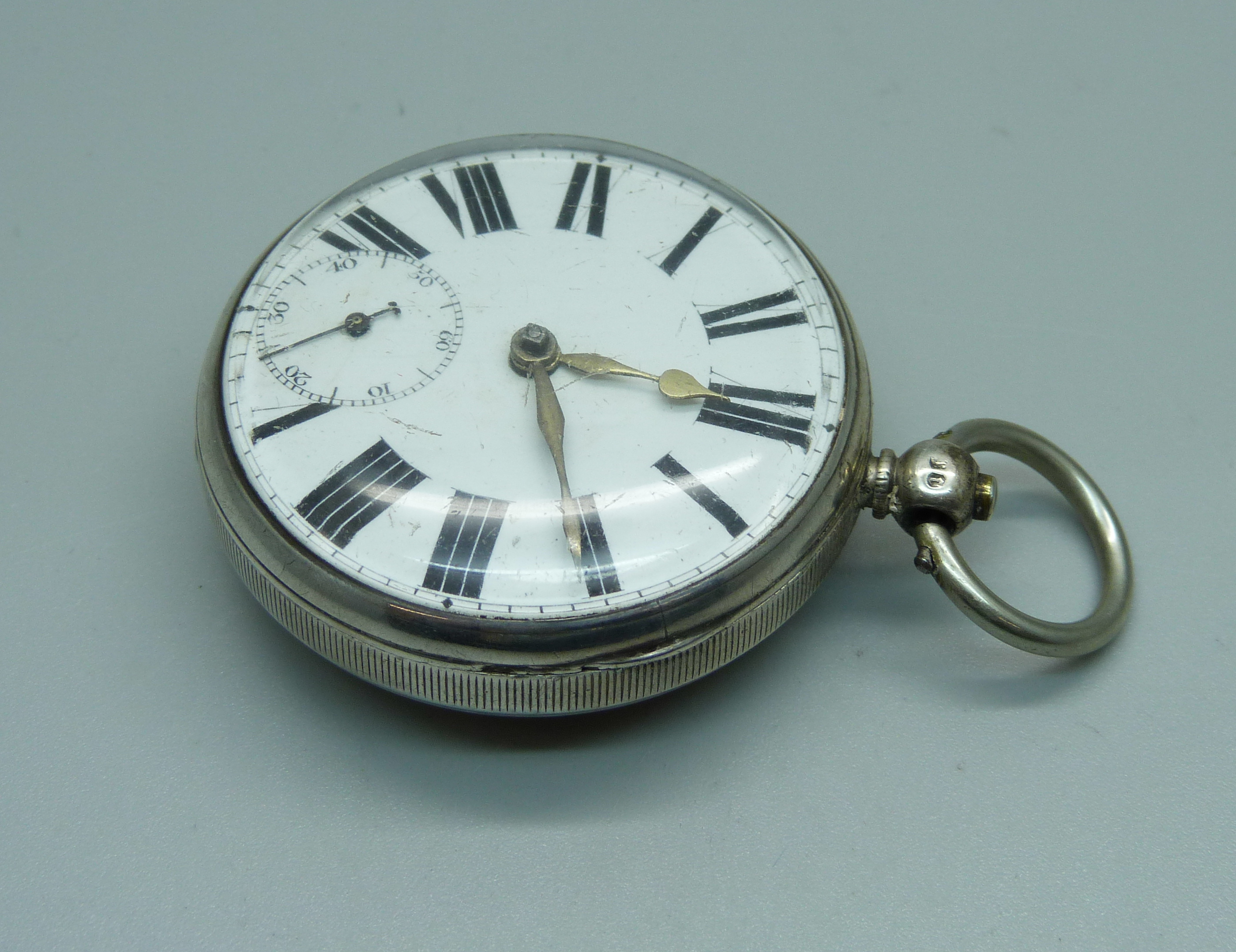 A silver pocket watch with verge fusee movement