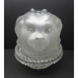 A frosted glass nightlight shade modelled as the head of a pug dog and Clarke's Patent Cricklite