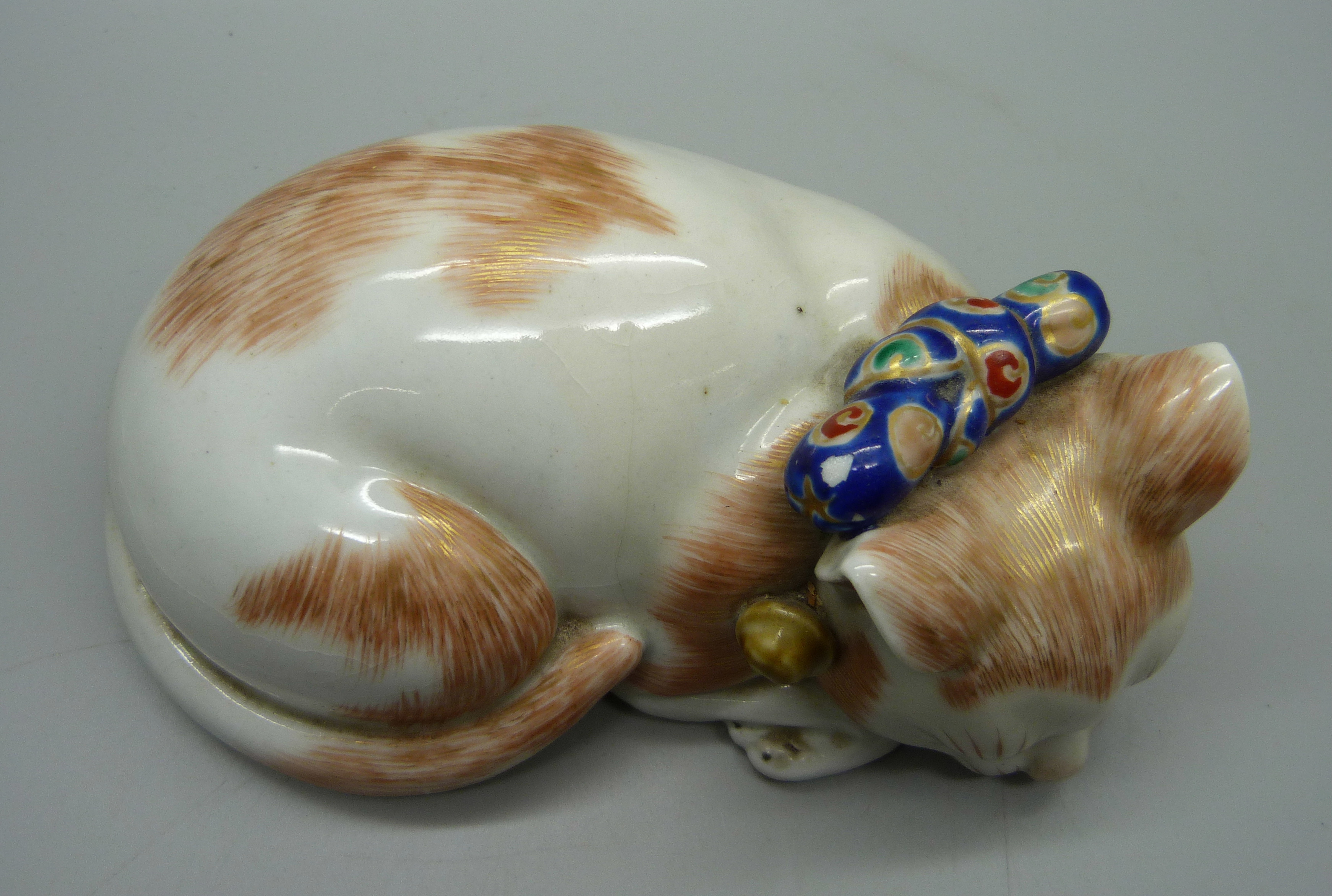 A Japanese Taisho period Kutani porcelain model of a sleeping cat, 15.5cm - Image 2 of 4