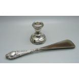 A small silver candlestick, a/f, and a silver handled shoehorn, a/f