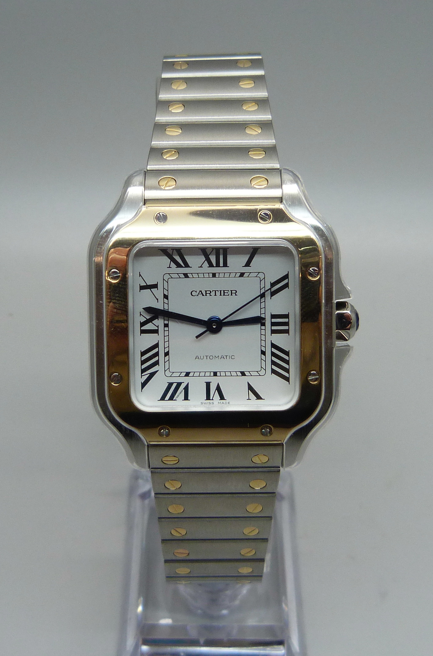 A Santos de Cartier steel and yellow gold wristwatch, with spare straps and buckle, with box and