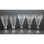 A set of five etched faceted stem drinking glasses
