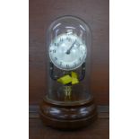 A Bulle 800 days electric clock with glass dome and base