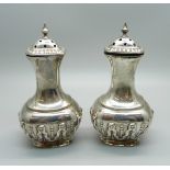 A pair of silver pepperettes, Birmingham 1899, 125g