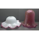 A quilted cranberry glass shade and white glass shade with applied cranberry frill