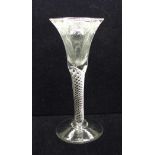 An 18th Century wine glass having a bell bowl with an engraved frieze of vines and grapes over an