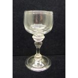 A wine glass, circa 1720, cup bowl with solid base over triple knop over an annvalated knop on