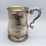 A silver mug with inscription, 277g