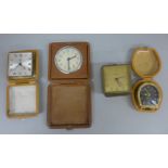 Four small clocks including two Swiza and an 8 Days travel clock