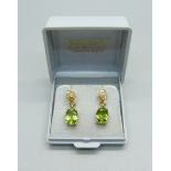 A pair of silver gilt, peridot and diamond drop earrings