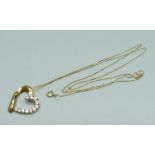 A 9ct gold heart shaped pendant on a fine 9ct gold chain, 1.8g