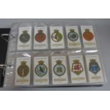 Cigarette cards; an album containing ten complete sets of cigarette cards including Wills Ship's