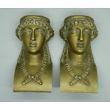 A pair of gilt brass ormolu neo-classical head brackets