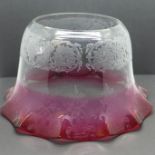 A large etched cranberry glass oil lamp shade