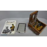 A small mahogany land camera, a/f and a book on antique cameras