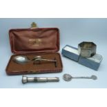 Silver items, a napkin ring, a cased christening spoon and pusher, a cigar spiker and a small spoon,