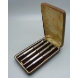 A set of four silver bridge pencils