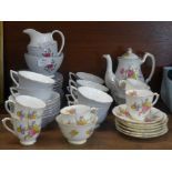 A Royal Doulton Chateau Rose tea set and a New Chelsea Staffordshire part tea set