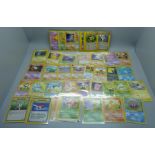 50 Pokemon cards from various sets