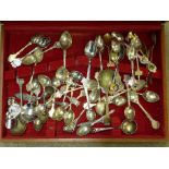 A collection of plated tea caddy spoons and collector's spoons including Rolex