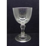 An 18th Century wine goblet, circa 1750, with a conical bowl over a Silesian stem on a domed foot,