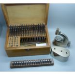 Watchmaker's tools:- a Favourite watch staking set, cased, and a set of roll-formers