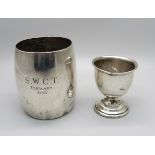 A silver cup with inscription and a silver egg cup, a/f, 130g
