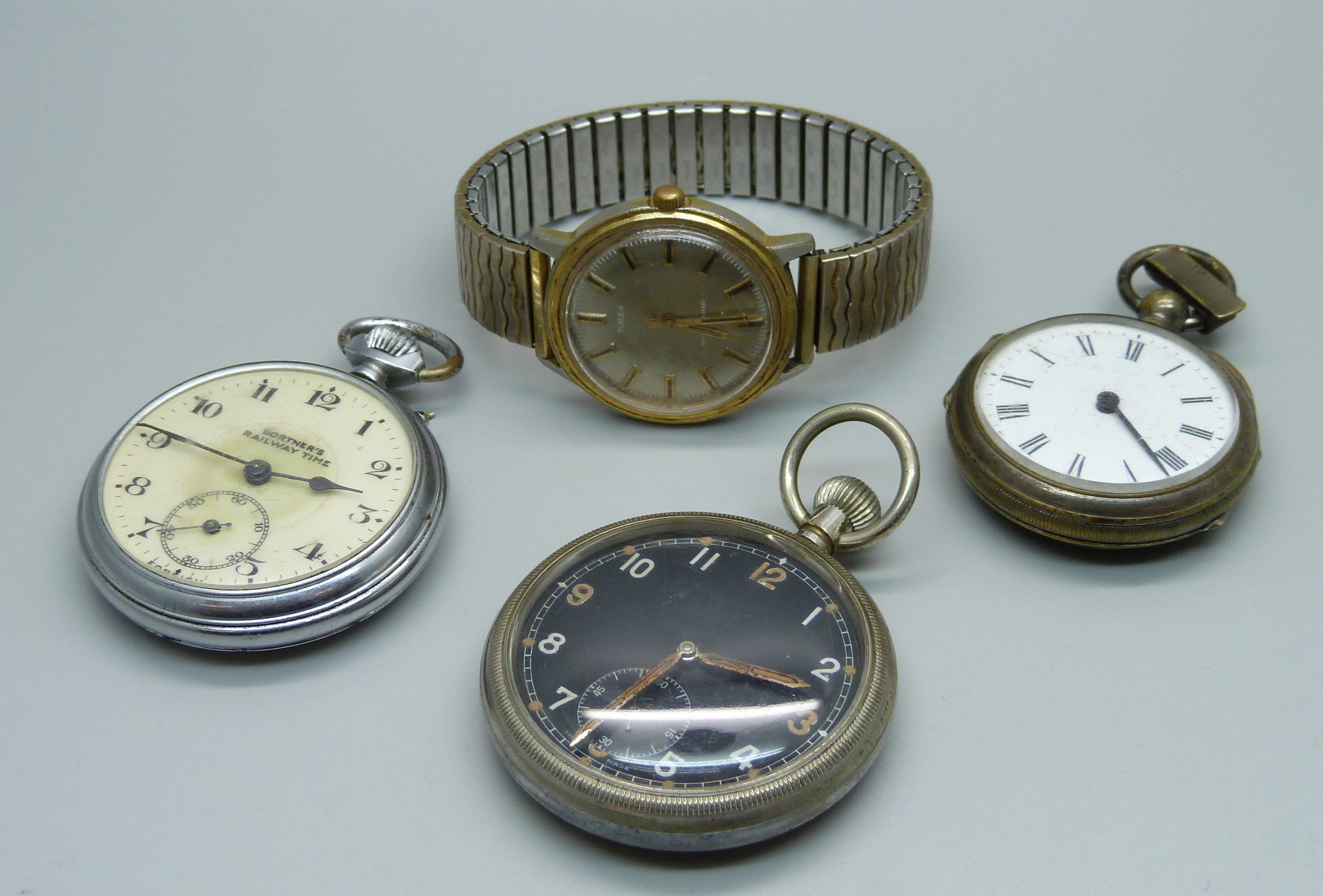 A railway pocket watch, a military pocket watch, a Timex wristwatch and a pedometer