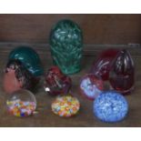 A collection of paperweights including a Victorian dump