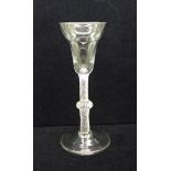 An 18th Century wine glass, circa 1770, with pan topped bowl over a single series opaque gauze