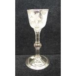 A wine glass, circa 1740, balustroid with ogee bowl with central knop over folded foot, 14.5cm
