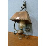 An Arts and Crafts wrought iron and copper hanging ceiling lantern