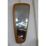 A teak asymmetrical framed mirror